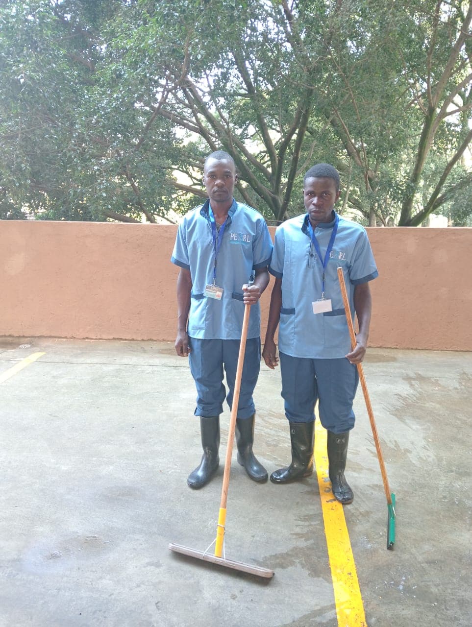 Two ECO Solutions crew members with cleaning equipment